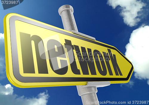 Image of Yellow road sign with network word under blue sky