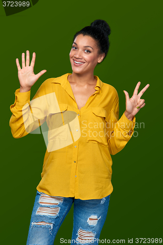 Image of Woman showing eight fingers