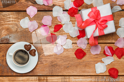 Image of Valentines Day gift and coffee  on wooden background
