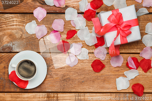 Image of Valentines Day gift and coffee  on wooden background