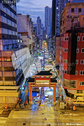 Image of HONG KONG, CHINA - DEC 27, 2015: Crowded people walk through the