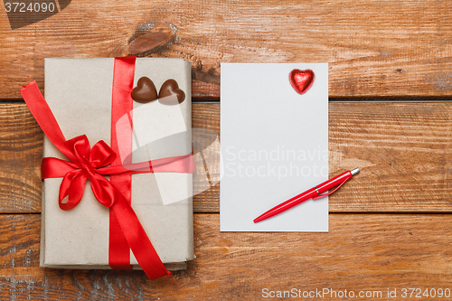 Image of Vintage gift box with small hearts  on  wooden background