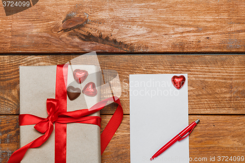 Image of Vintage gift box with small hearts  on  wooden background