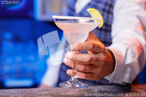 Image of Barman at work, preparing cocktails.