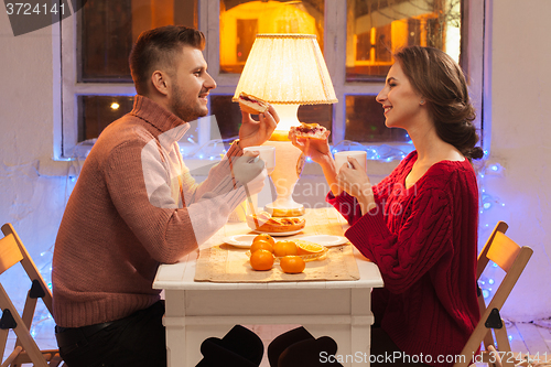 Image of Portrait of romantic couple at Valentine\'s Day dinner