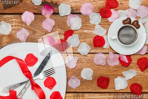 Image of The rribbon on  wooden background with a cup of coffee