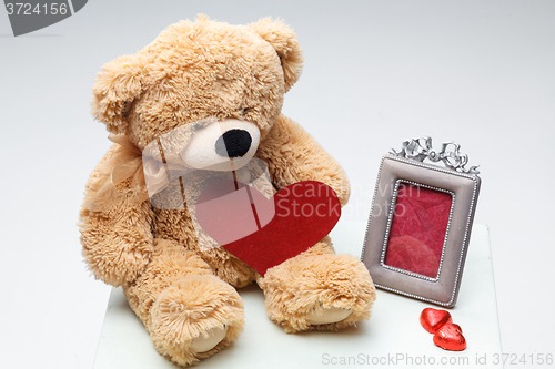 Image of Teddy Bears couple with red heart. Valentines Day concept.