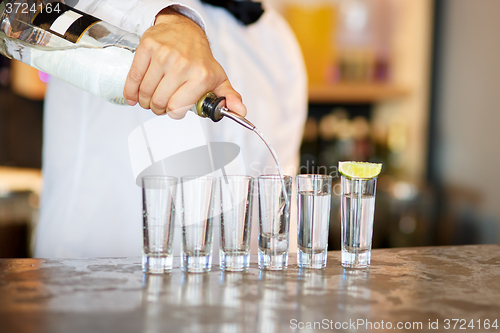 Image of Barman at work, preparing cocktails.