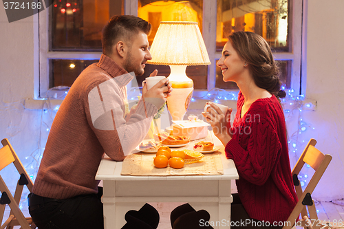 Image of Portrait of romantic couple at Valentine\'s Day dinner