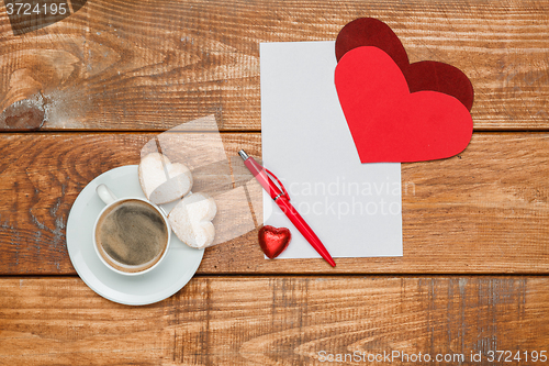 Image of The blank sheet of paper and pen with  hearts  