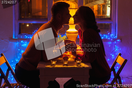 Image of Portrait of romantic couple at Valentine\'s Day dinner