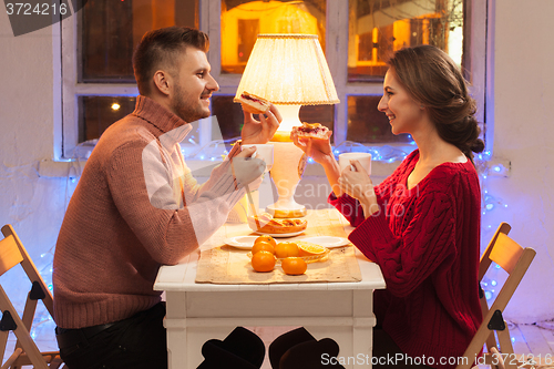 Image of Portrait of romantic couple at Valentine\'s Day dinner