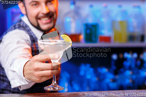 Image of Barman at work, preparing cocktails.