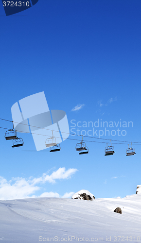 Image of Chair-lift and blue sky at evening