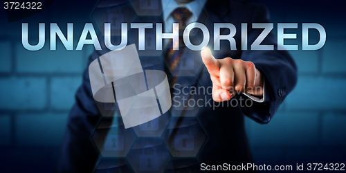 Image of Manager Touching The Word UNAUTHORIZED Onscreen