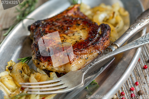 Image of Pork chop with bone close-up.