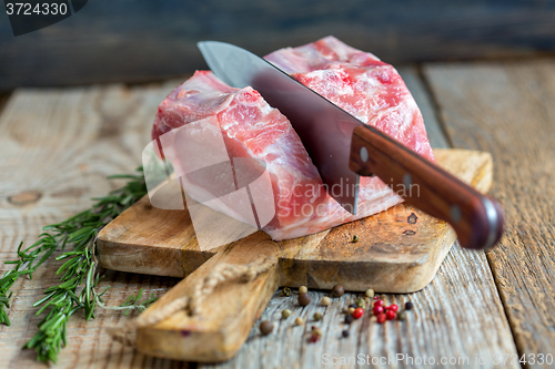 Image of Cutting pork loin.