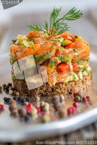 Image of Tartare with salmon, green onions and capers.