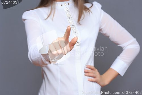 Image of woman in front of visual touch screen.