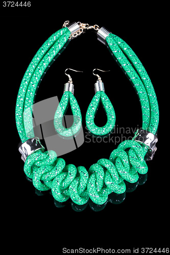 Image of green Rope Necklace. on black background