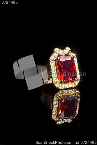 Image of beautiful gold ring with precious stone 