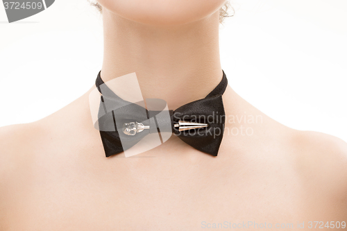 Image of black tie bow on female neck. 