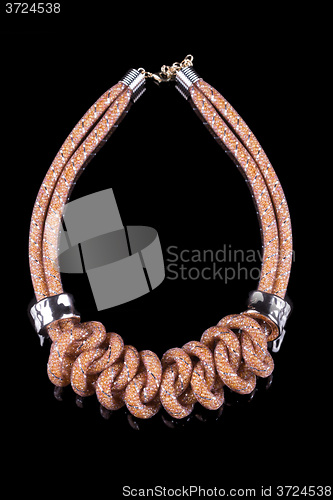 Image of brown Rope Necklace. on black background