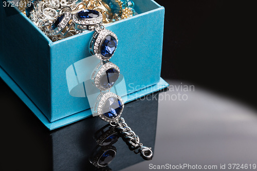 Image of Bracelet with blue stones in a box 