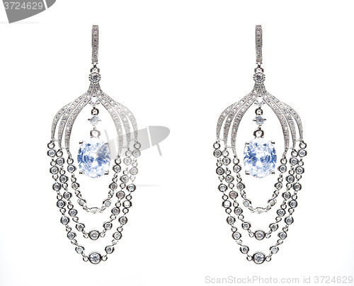 Image of earrings with blue stones on the white