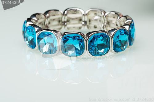 Image of Bracelet with blue stones over white