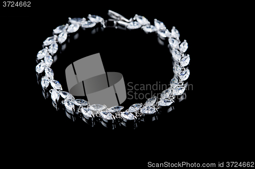 Image of beautiful girl with a silver pendant around his neck