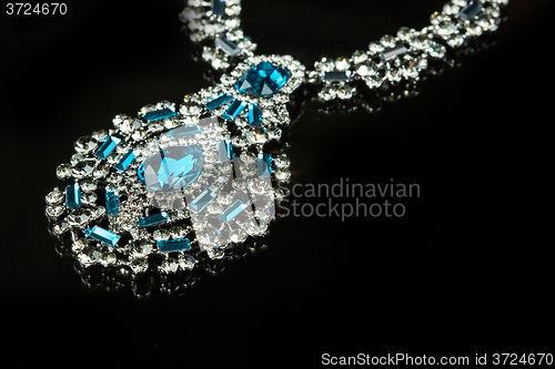 Image of Necklace with large jewels. on black background