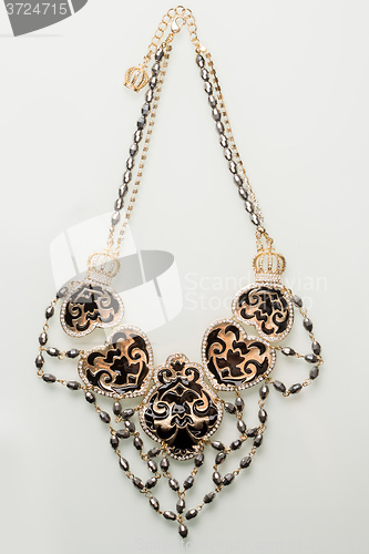 Image of Necklace with black pearls on a white 