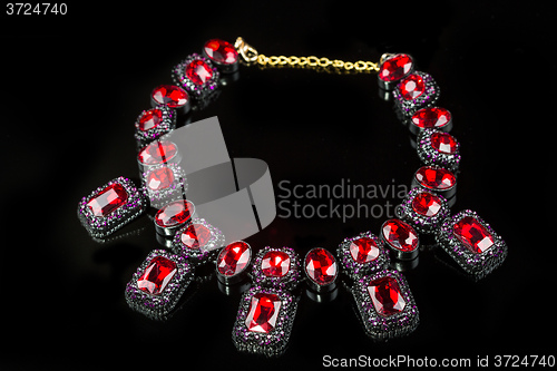 Image of red plastic  necklace