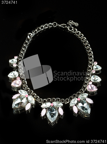 Image of Necklace with large jewels. on black background