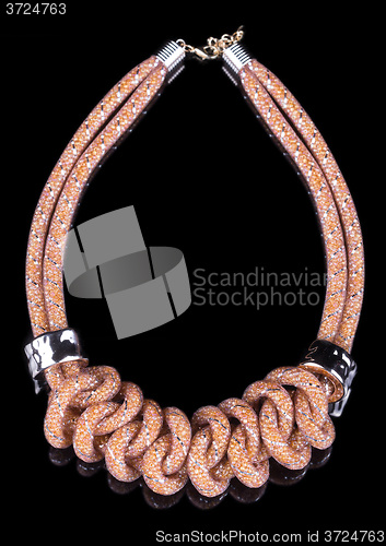 Image of brown Rope Necklace. on black background