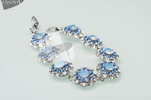 Image of Bracelet with blue stones over white