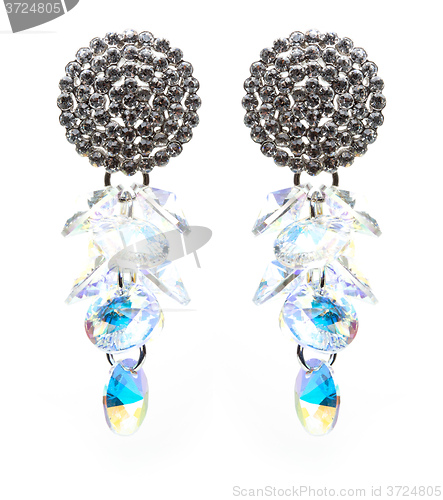 Image of earrings with blue stones on the white