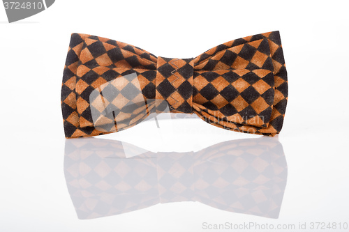 Image of Brown bow tie on a white background 