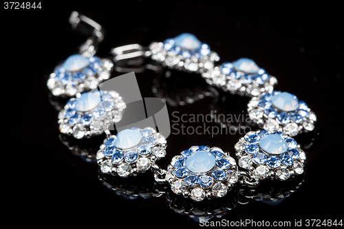 Image of Bracelet with blue stones over black 