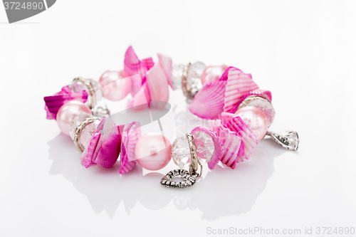 Image of pink bracelet with pendants 