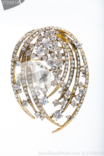 Image of Round golden brooch with diamonds 
