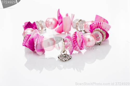 Image of pink bracelet with pendants 