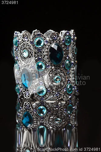 Image of Bracelet with blue stones over black 