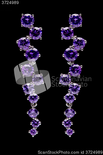 Image of earring with colorful purple gems 