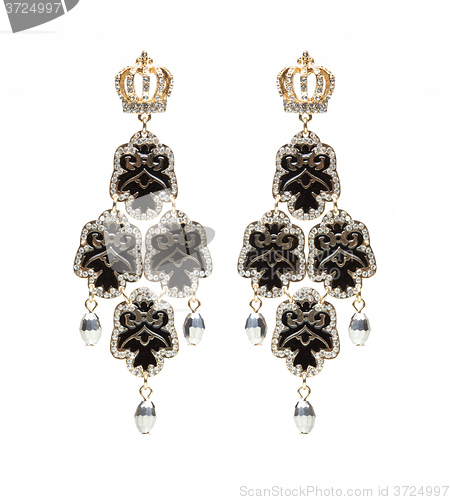 Image of earrings with black stones on the white