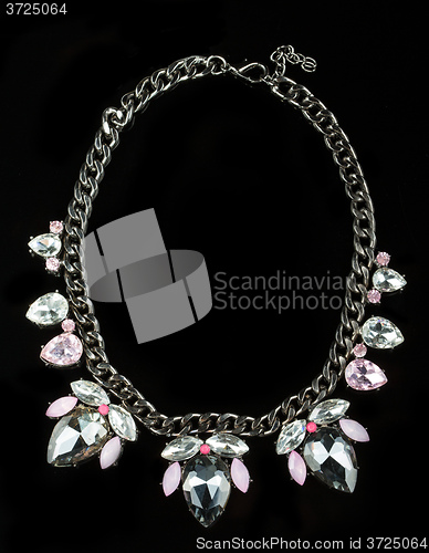 Image of Necklace with large jewels. on black background