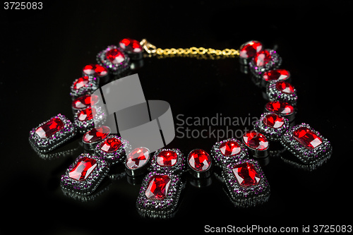 Image of red plastic  necklace