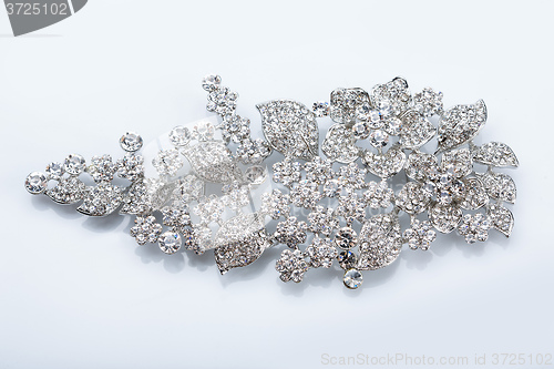Image of silver brooch with diamonds 