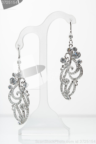 Image of earrings with Briliant on the white